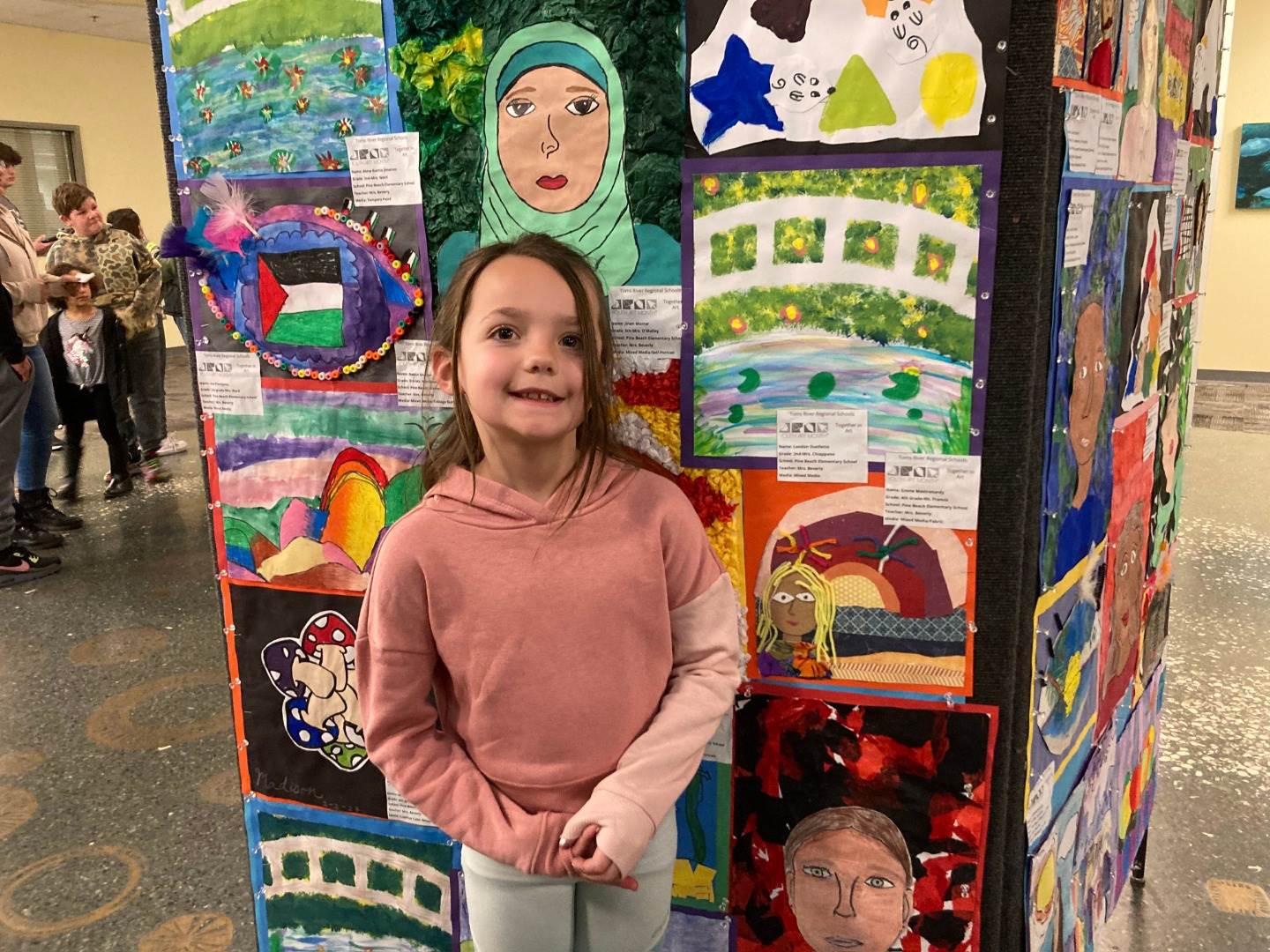 YAM student in front of display 3